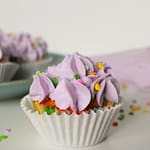 confetti sprinkle cupcakes with purple buttercream frosting