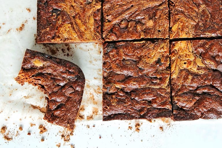 Peanut butter swirl brownies with sprinkled cocoa powder